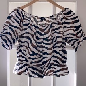 Small peplum animal patterned cotton top. So cute and fun. Too small on me :(.